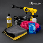 LeFCart MZ car wash kit including a yellow pressure washer, black hose, gray microfiber cloths, pink and blue microfiber wheels, a bottle of Lefcart Carbing Solution, and a blue Aero Guard package, arranged on a dark gray background.