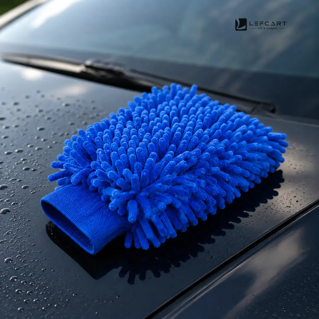 A bright blue microfiber car wash mitt resting on a wet black car hood, with water droplets visible and a LEFCART logo in the top right corner.